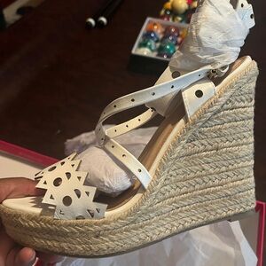 Nikolina white Wedge platform heels.